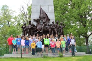 Group standing in front of a Gettysburg monument